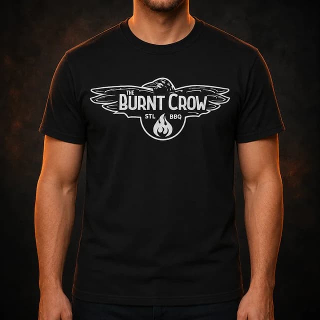 Adult model wearing the front of a black T-shirt with the white Burnt Crow classic logo